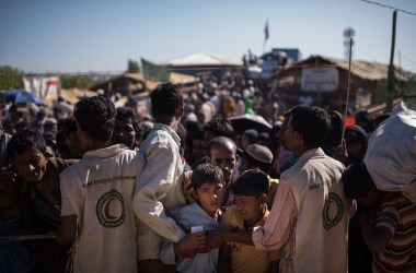 Rohingya Muslim refugees queue for aid suplies at the Kutupalong camp on December 4th, 2017.