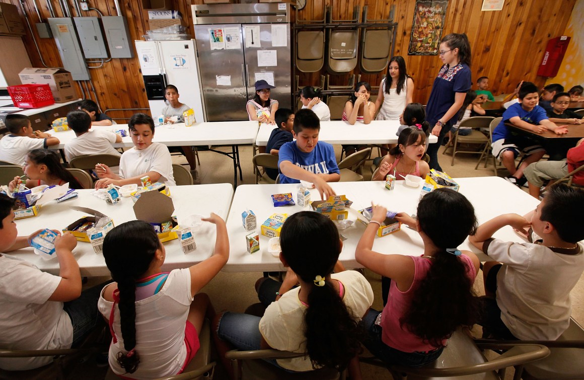 Children eat breakfast at the start of a day camp program at Casa Juan Diego St. Pius V Youth Center on June 24th, 2009, in Chicago. The center provides free breakfast and lunch to about 90 children a day.