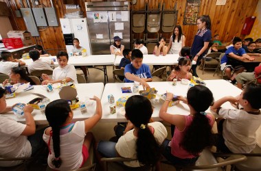 Children eat breakfast at the start of a day camp program at Casa Juan Diego St. Pius V Youth Center on June 24th, 2009, in Chicago. The center provides free breakfast and lunch to about 90 children a day.