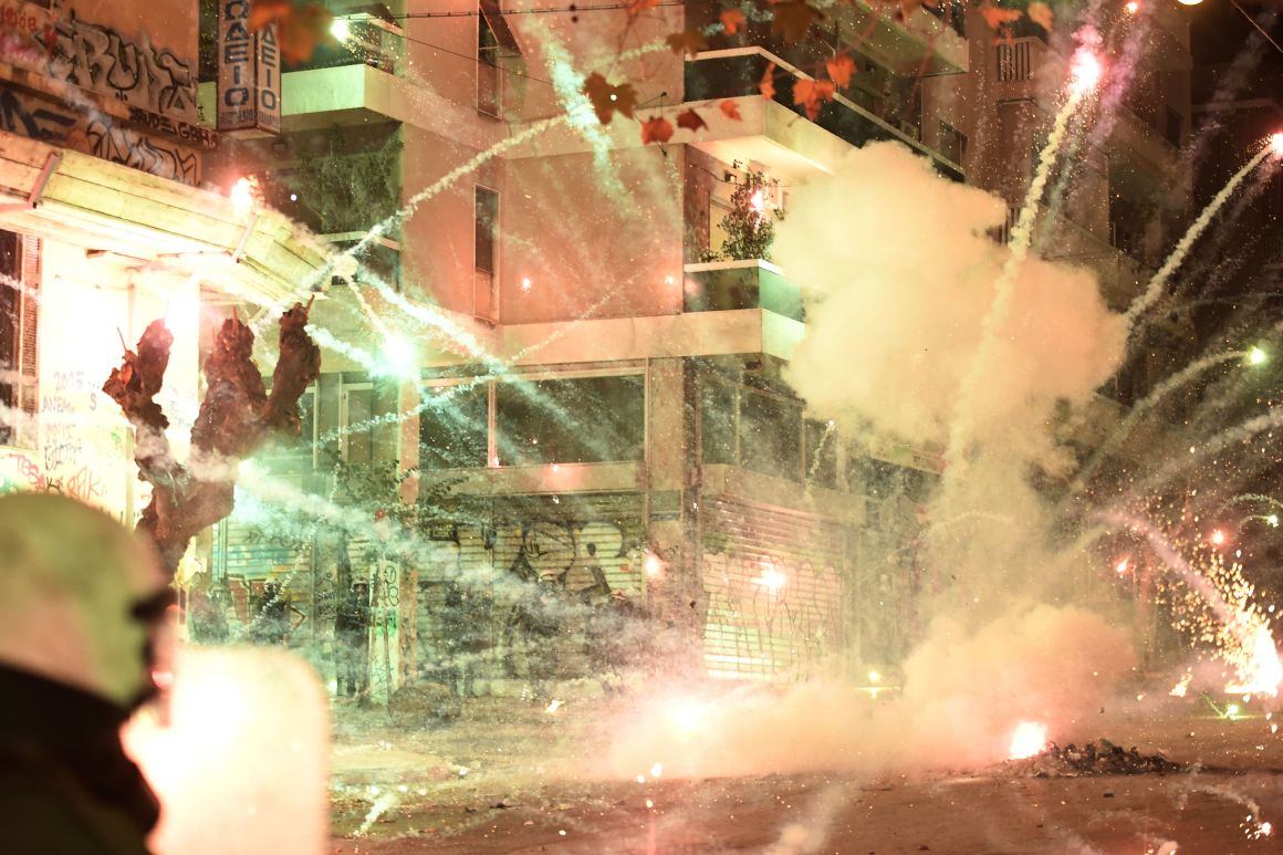 A firework explodes during clashes between protesters and police in central Athens on December 6th, 2017, at a demonstration commemorating 15-year-old Alexis Grigoropoulos, who was fatally shot by a police officer in 2008. Masked youths threw stones and vandalized property during the annual protests.