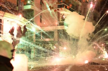 A firework explodes during clashes between protesters and police in central Athens on December 6th, 2017, at a demonstration commemorating 15-year-old Alexis Grigoropoulos, who was fatally shot by a police officer in 2008. Masked youths threw stones and vandalized property during the annual protests.