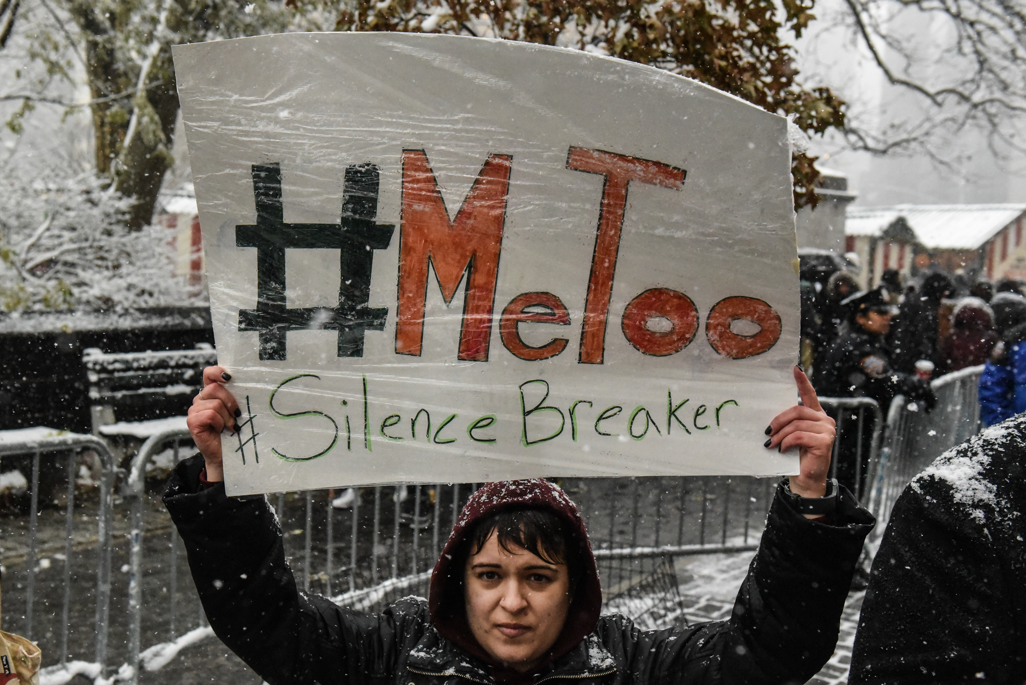 People carry signs at a #MeToo rally on December 9th, 2017, in New York City.