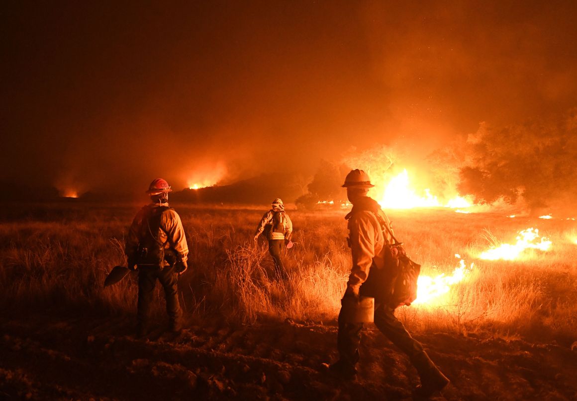 Firefighters light backfires as they try to contain the Thomas wildfire in Ojai, California, on December 9th, 2017.