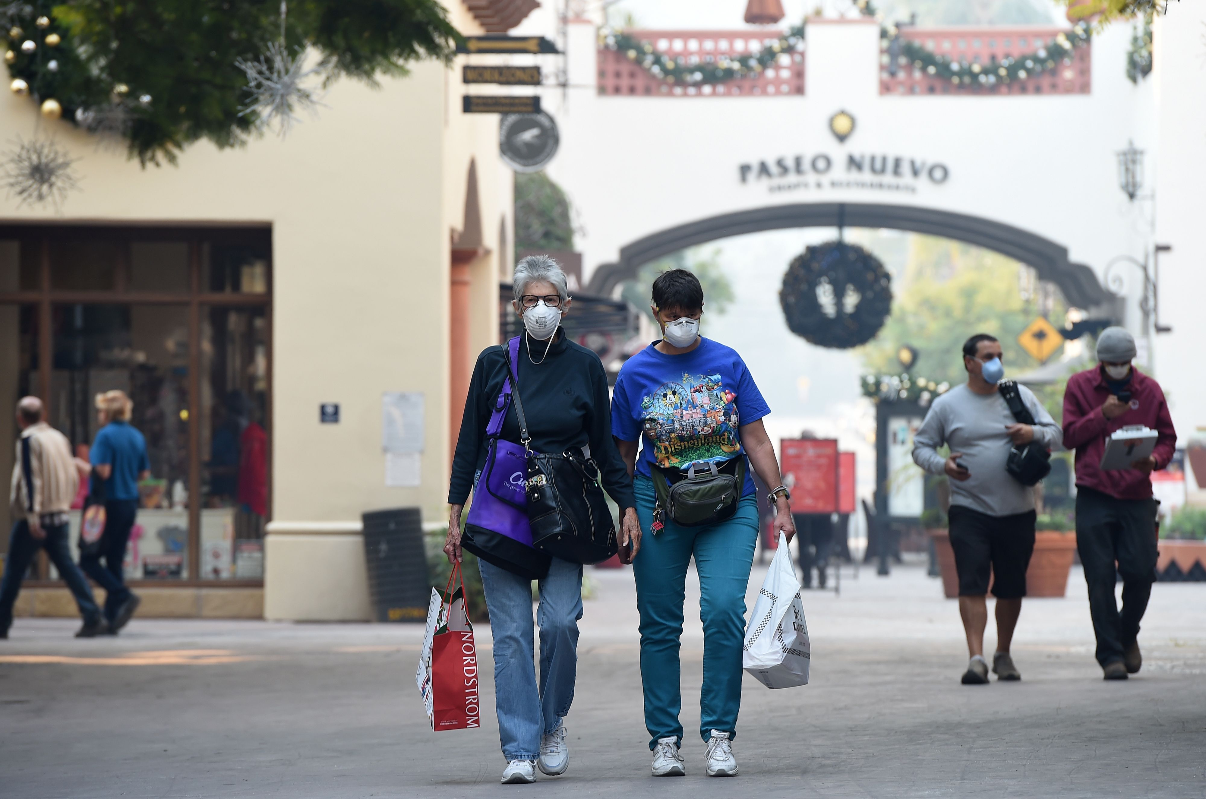 Shoppers wear masks to protect themselves from smoke and ash from the Thomas Fire in Santa Barbara, California, on December 12th, 2017.