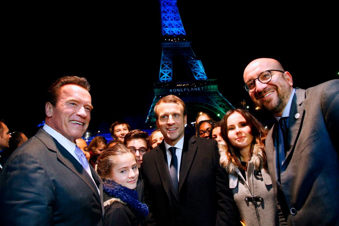 Former Governor of California Arnold Schwarzenegger with French President Emmanuel Macron and Belgian Prime Minister Charles Michel aboard a boat on the River Seine after the One Planet Summit in Paris on December 12th, 2017.