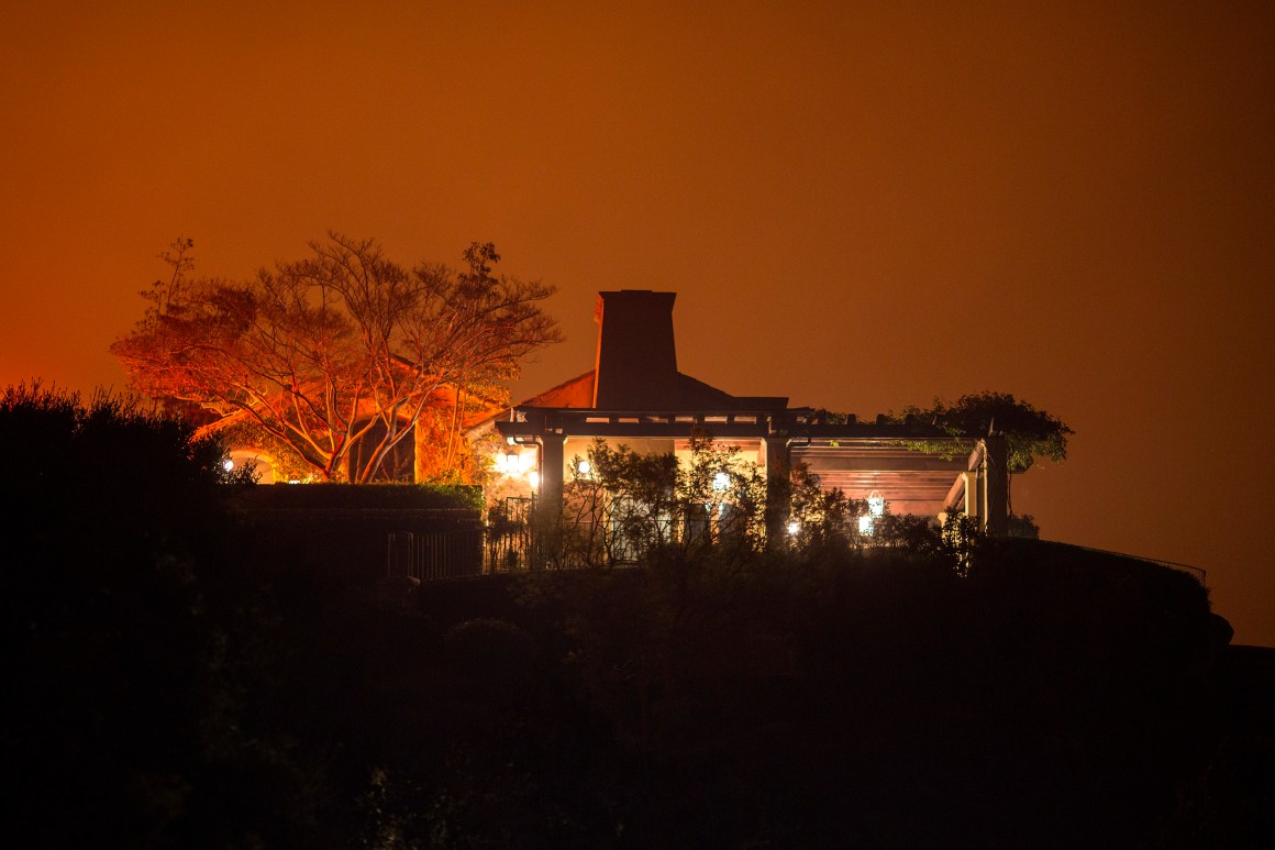 The Thomas Fire approaches a home on December 12th, 2017, in Montecito, California.