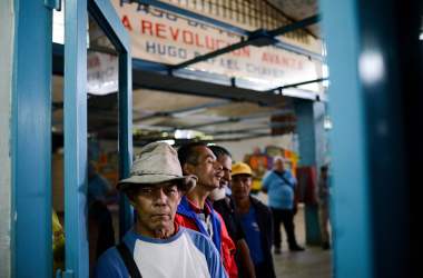 People line up outside the BanPanal communal bank to exchange bolivares for the new local community currency, the panal, launched in the 23 de Enero working-class neighborhood in Caracas, Venezuela, on December 15th, 2017.