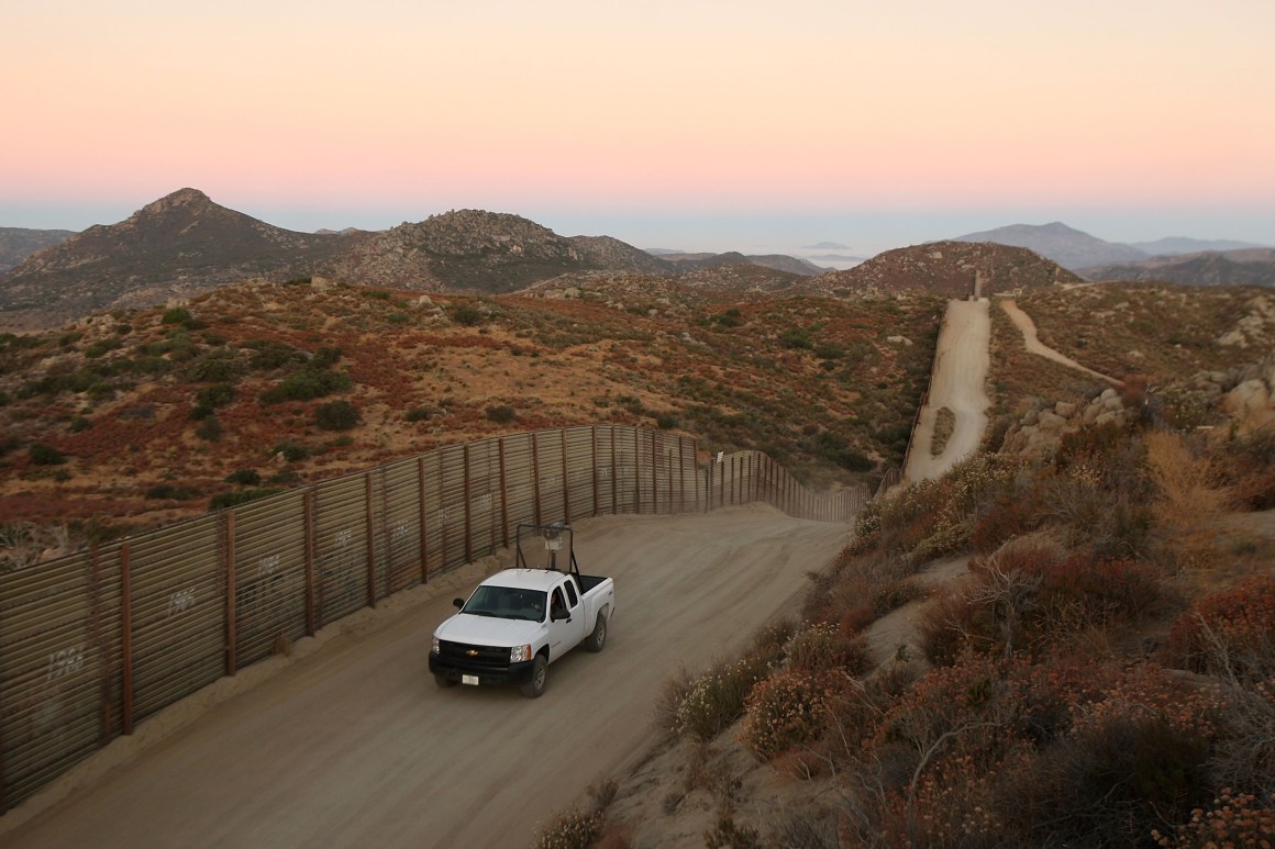 A U.S. Border Patrol agent searches for tracks after a night of surveillance using night-vision equipment as agents carry out special operations near the U.S.-Mexico border fence.