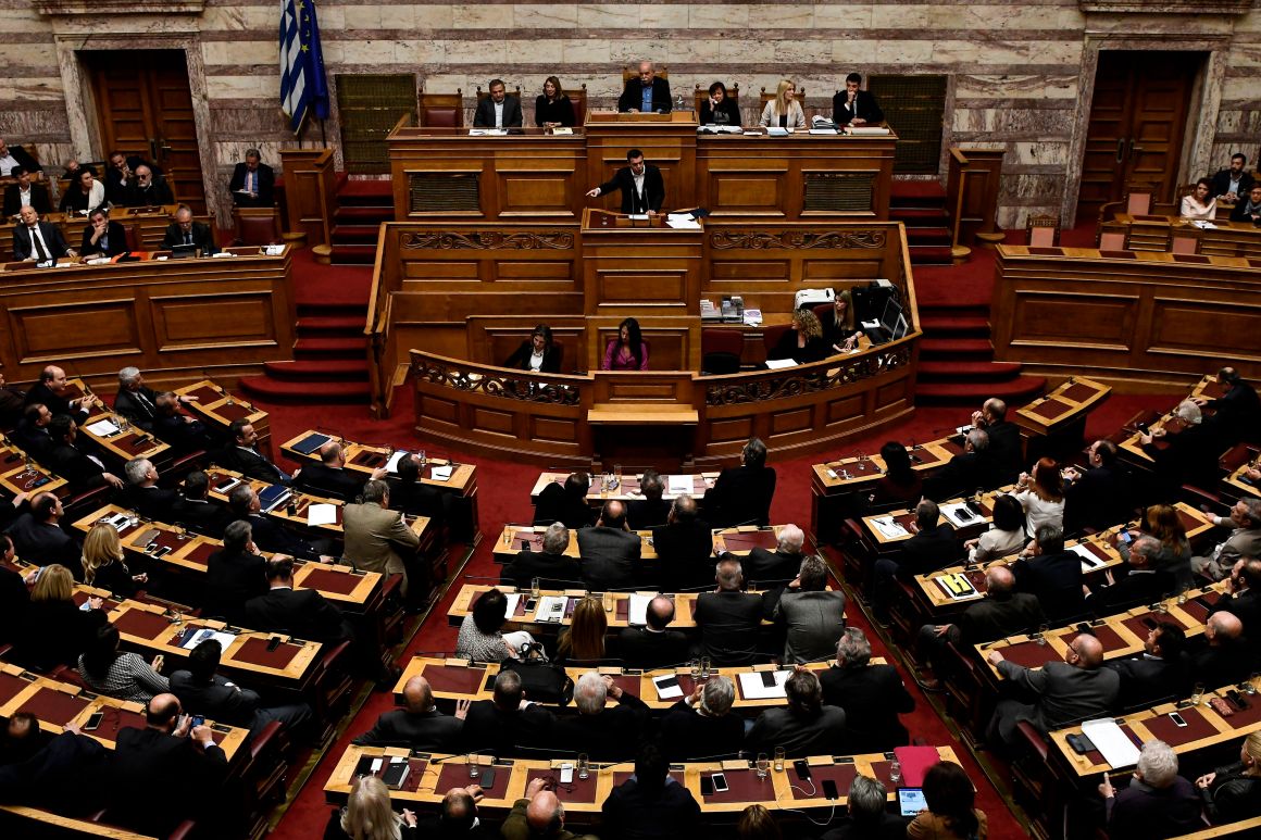 Greek Prime Minister Alexis Tsipras gestures as he delivers a speech during a parliamentary session in Athens on December 19th, 2017.