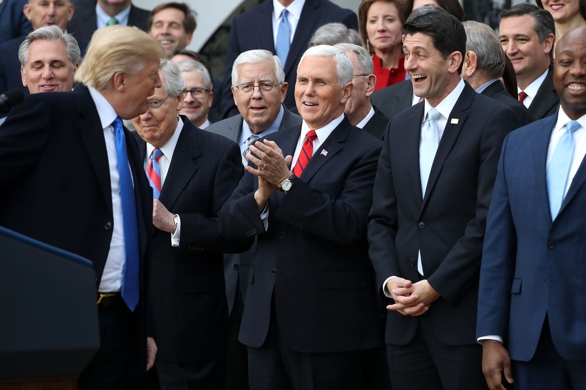 Donald Trump, Mike Pence, Mitch McConnell, and Paul Ryan celebrate the passage of the Tax Cuts and Jobs Act of 2017 on the South Lawn of the White House.