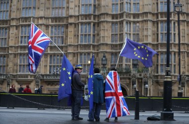 Pro-European Union, anti-Brexit demonstrators hold Union and E.U. flags outside the Houses of Parliament in London on December 21st, 2017.