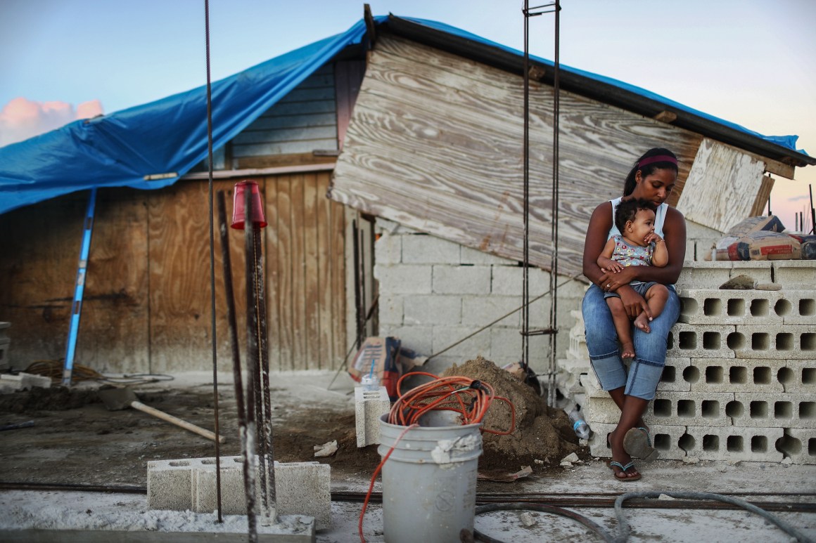 Isamar holds her nine-month-old baby at their makeshift home in San Isidro, Puerto Rico, on December 23rd, 2017.