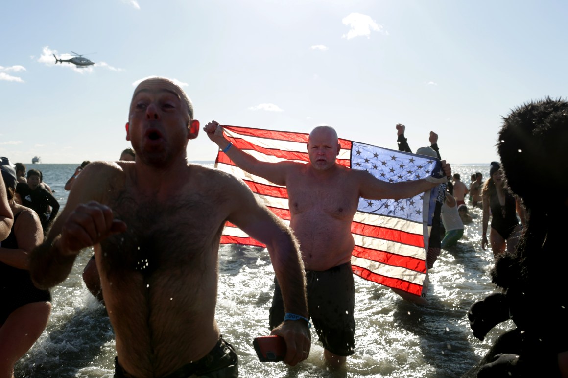 Polar Bear Club swimmers make their annual icy plunge into the Atlantic Ocean on New Year's Day at Coney Island in the Brooklyn borough of New York City.