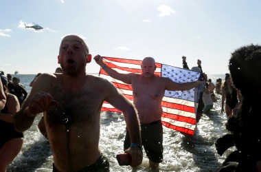 Polar Bear Club swimmers make their annual icy plunge into the Atlantic Ocean on New Year's Day at Coney Island in the Brooklyn borough of New York City.