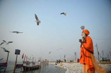 An Indian sadhu performs evening prayer at Sangam during the Magh Mela festival in Allahabad on January 9th, 2018.