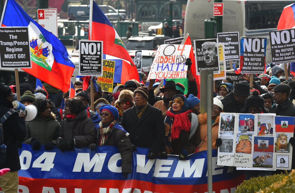 Protesters with the 1804 Movement for All Immigrants march with the Haitian community and other immigrant forces across the Brooklyn Bridge.