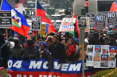 Protesters with the 1804 Movement for All Immigrants march with the Haitian community and other immigrant forces across the Brooklyn Bridge.