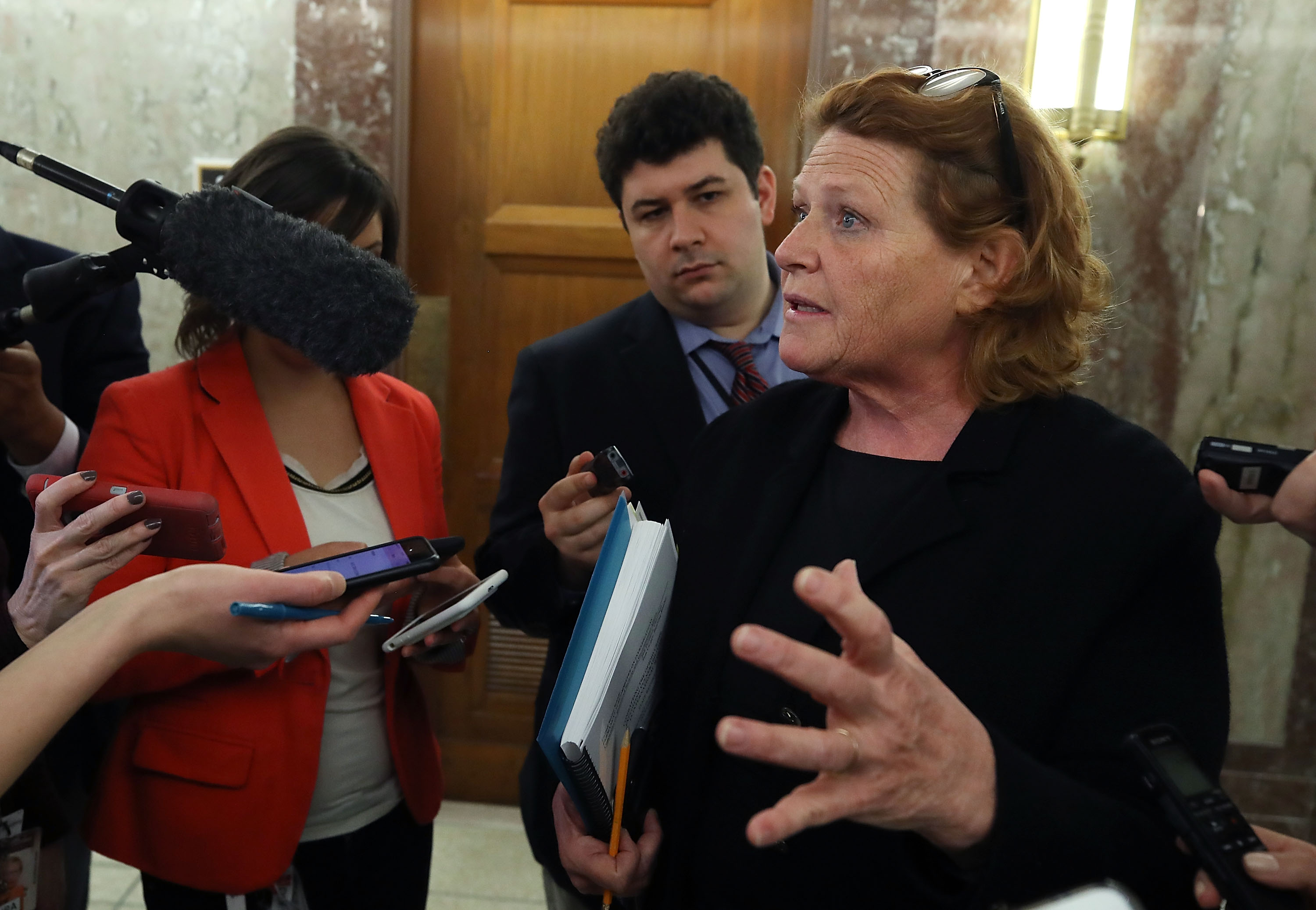 Senator Heidi Heitkamp speaks to reporters on January 25th, 2018, in Washington, D.C.