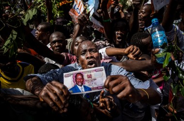 Supporters react before the Kenyan opposition National Super Alliance (NASA) coalition leader has himself sworn in as the 'people's president' on January 30th, 2018 in Nairobi. Kenyan opposition leader Raila Odinga had himself sworn in as an alternative president in front of thousands of supporters, three months after an election he claims was stolen from him.