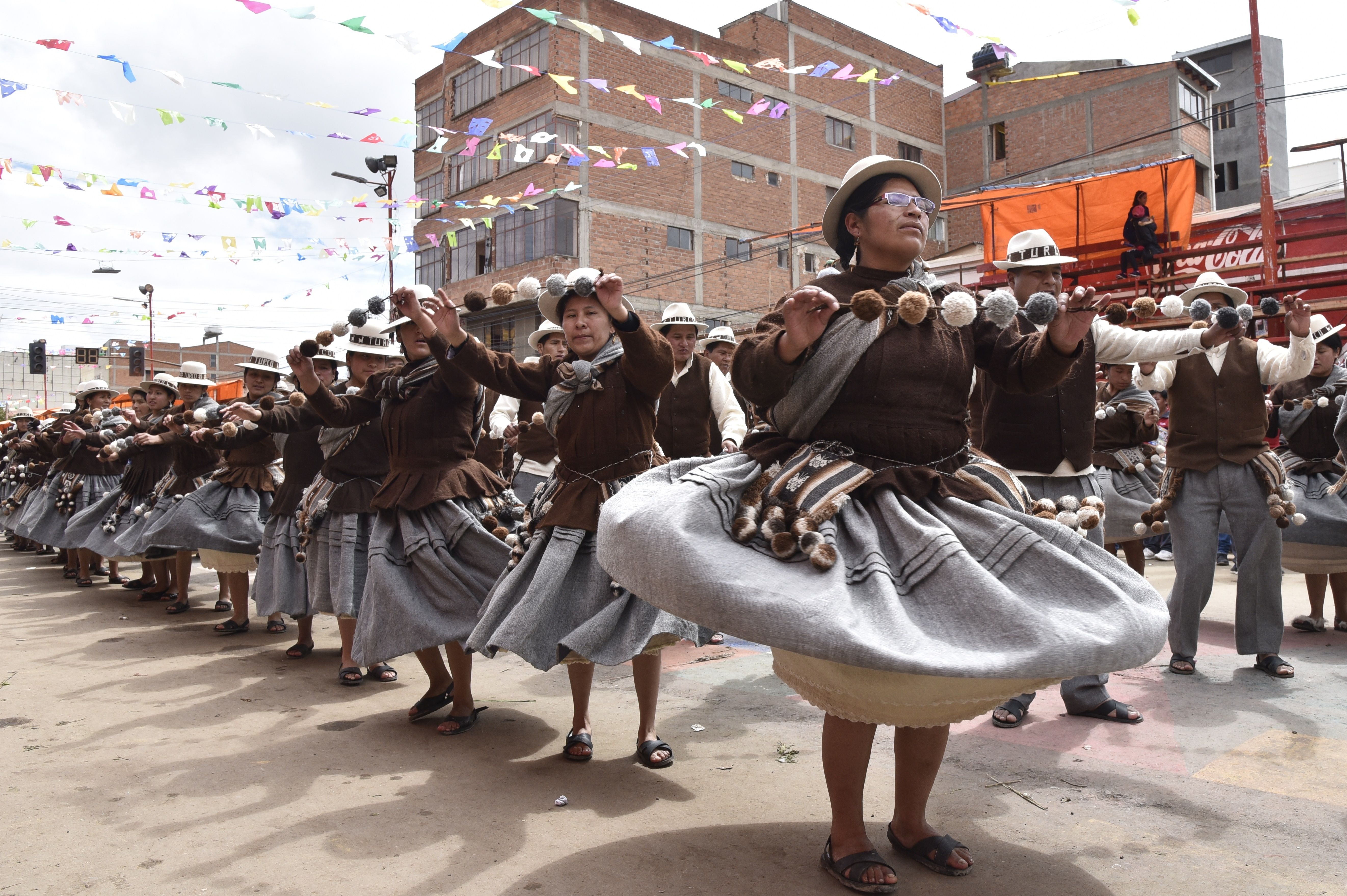 Aymara indigenous people perform traditional Andes highlands folk dances during the Anata Andino harvest festival in Oruro, Bolivia, on February 8th, 2018. During the harvest festival, native peasant farmers from different Bolivian highlands communities dance in the streets of Oruro giving thanks to Pachamama (Mother Earth) for the abundant crops.