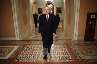 Senate Majority Leader Mitch McConnell returns to the U.S. Capitol just before midnight on February 8th, 2018, in Washington, D.C.