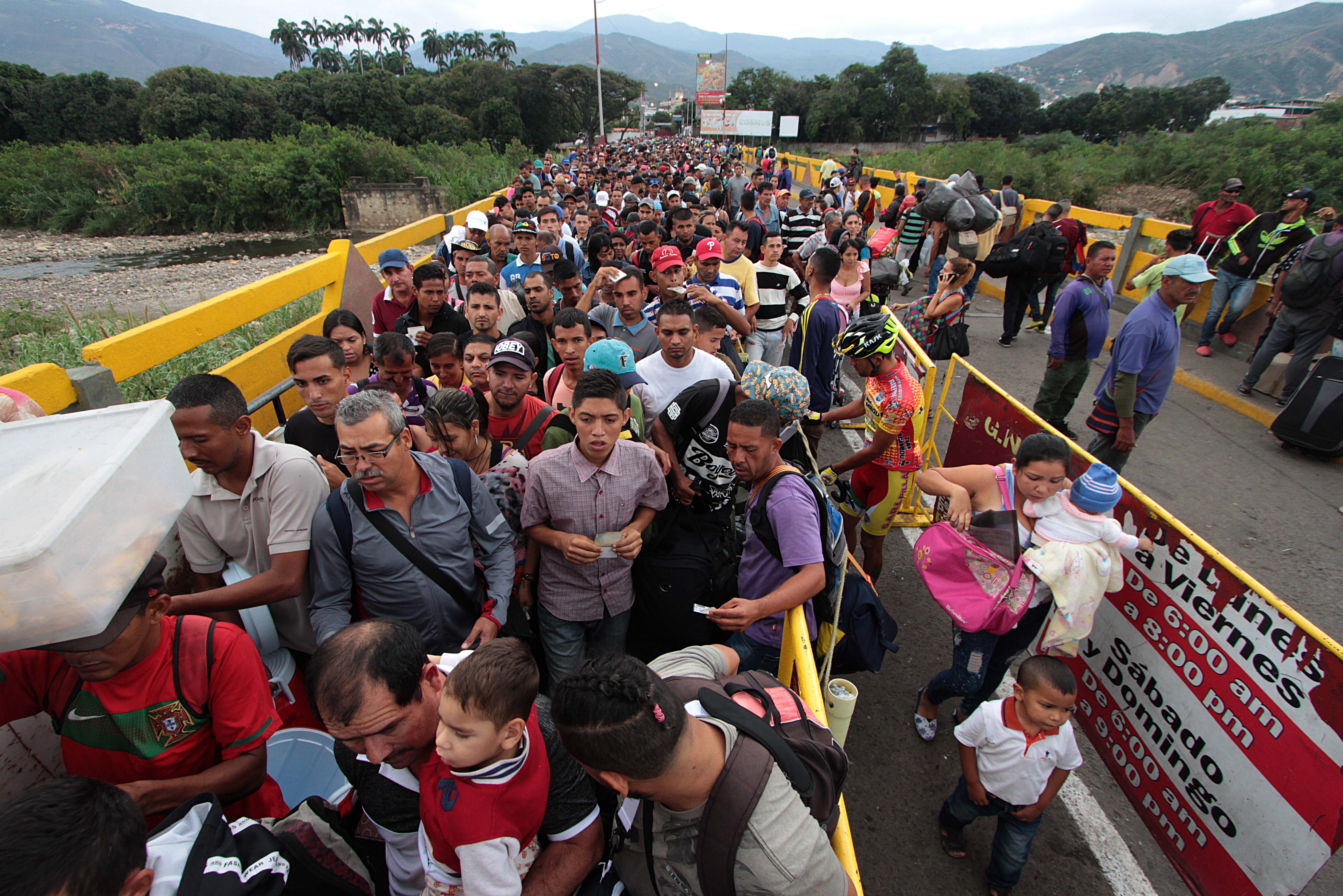 Venezuelan citizens cross the Simon Bolivar international bridge from San Antonio del Tachira in Venezuela to Norte de Santander province of Colombia on February 10th, 2018.