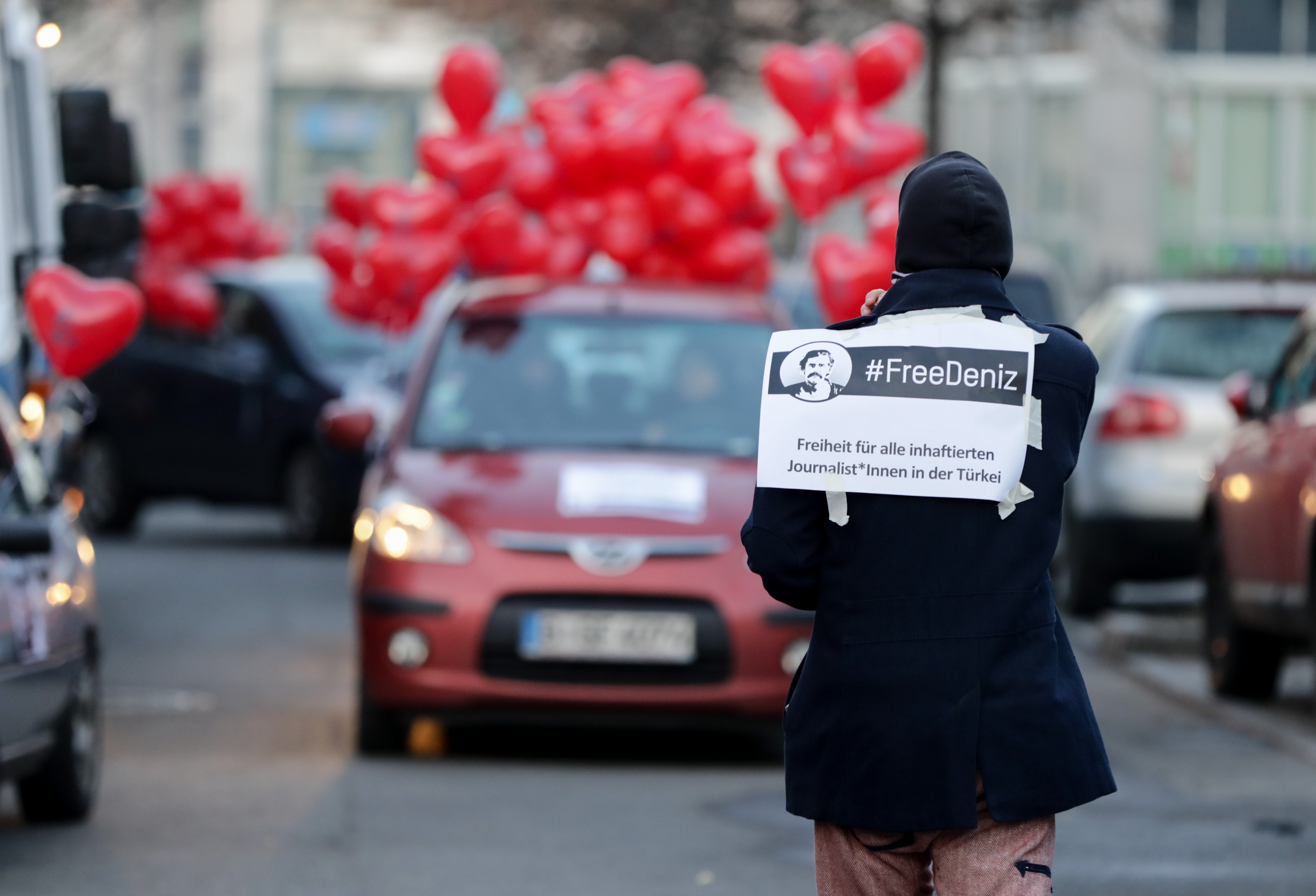 Supporters of German-Turkish journalist Deniz Yücel demonstrate with heart-shaped balloons during a motorcade protest on February 14th, 2018, in Berlin, Germany. The day marks Yücel's first full year in custody in Turkey without charge. Turkish Prime Minister Binali Yildirim expressed hope ahead of key talks in Berlin that Yücel would soon be freed after spending one year behind bars.