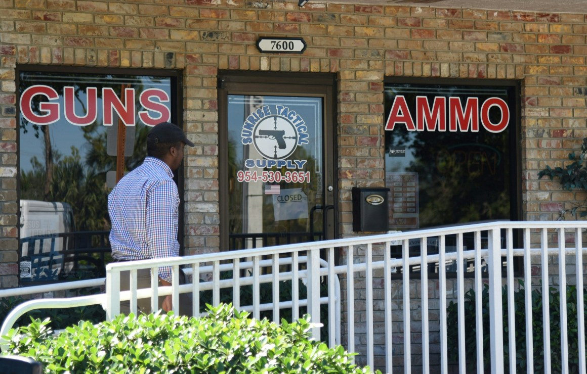 A man walks outside of Sunrise Tactical Supply store in Coral Springs, Florida, on February 16th, 2018.