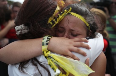 Madison Fox is hugged as the West Boca High School student joined hundreds of fellow students that walked to Marjory Stoneman Douglas High School in honor of the 17 students shot dead on February 20th, 2018, in Parkland, Florida.