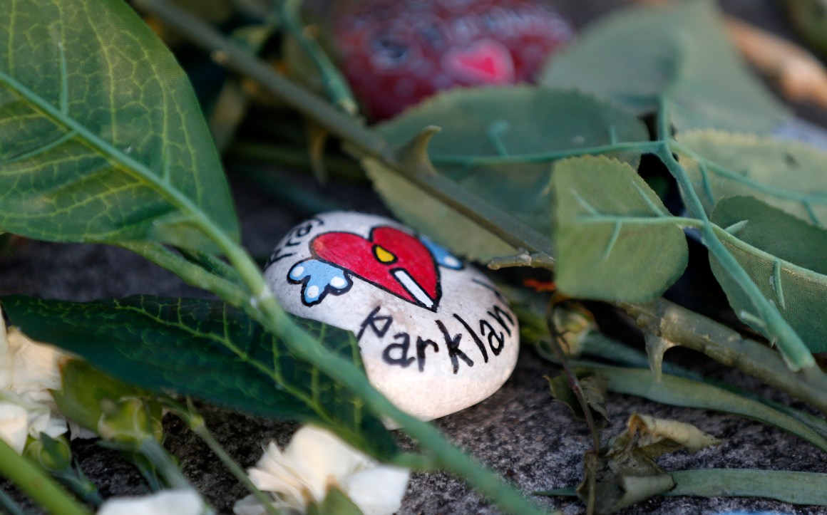 A painted rock sits outside one of the makeshift memorials at Marjory Stoneman Douglas High School in Parkland, Florida, on February 27th, 2018.