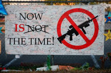 A sign hangs on a fence at Marjory Stoneman Douglas High School in Parkland, Florida, on February 27th, 2018.