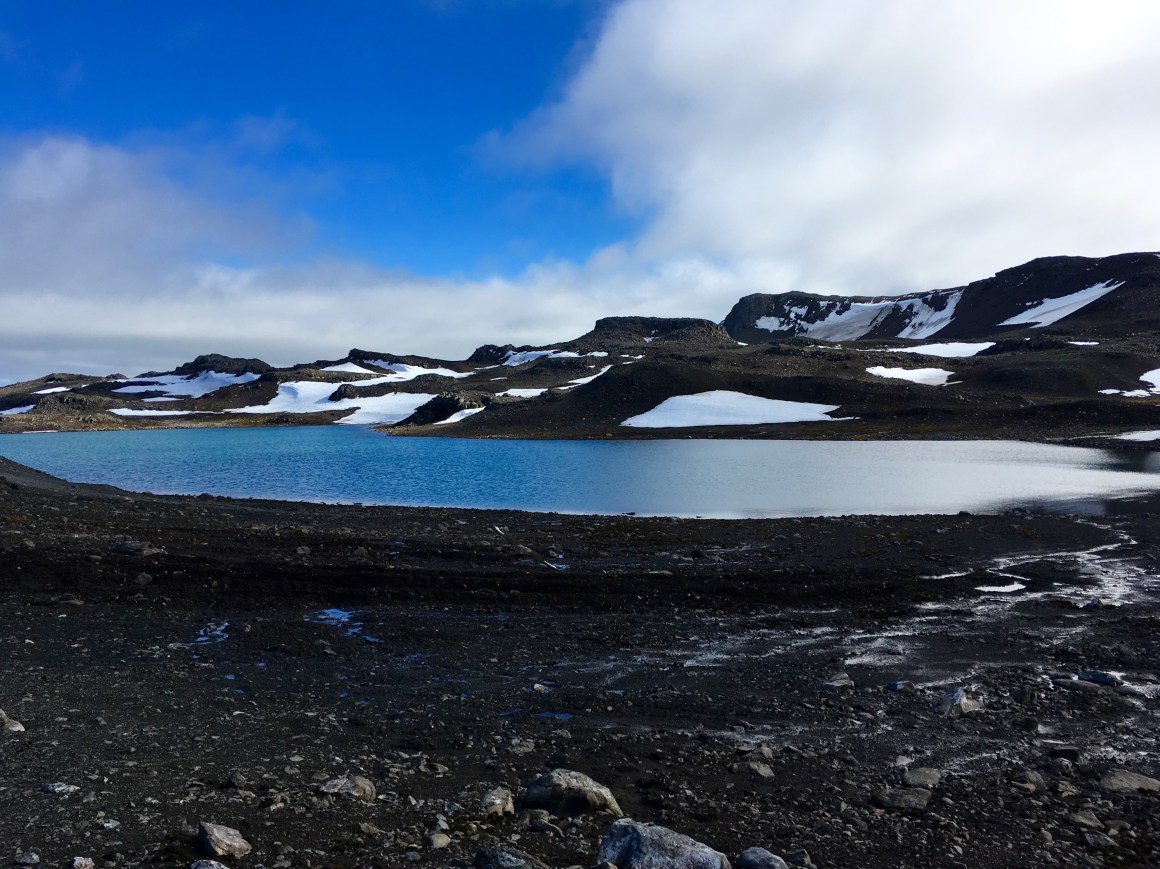 A fresh water lake is formed by the melting of ice on King George Island, Antarctica, on February 1st, 2018.