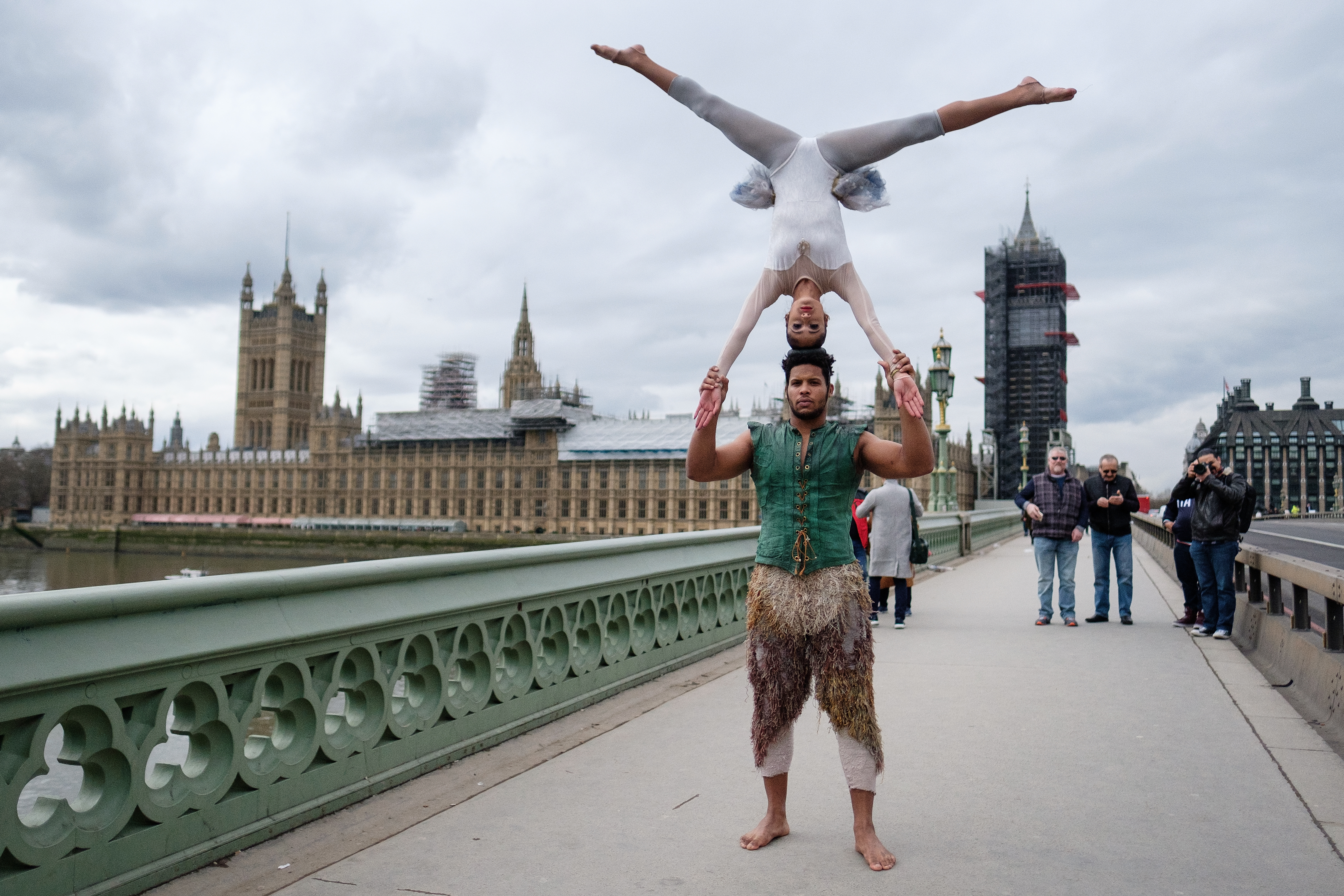 Circus artists perform on Westminster Bridge to mark the 250th anniversary of the modern-day circus ahead of a reception in the Houses of Parliament on March 6th, 2018, in London, England.