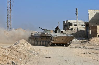 A Syrian army APC rolls in the former rebel-held area of Beit Nayem in the Eastern Ghouta region on the outskirts of the capital Damascus.