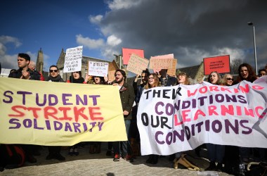 University workers attend a rally outside the Scottish Parliament on March 8th, 2018, in Edinburgh, Scotland. Politicians, students, and union officials joined Scottish university staff as they demonstrated over pensions changes.