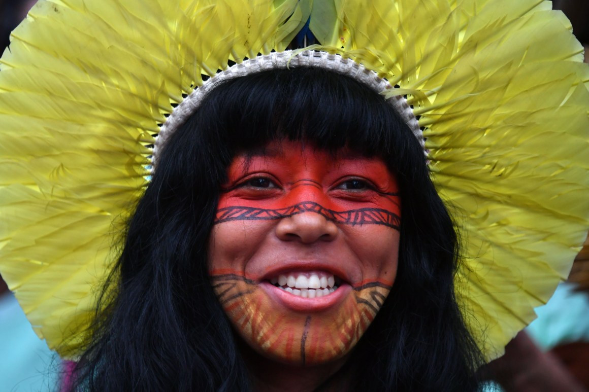 A Brazilian indigenous young woman marches along Paulista Avenue during the commemoration of the International Women's Day in Sao Paulo, Brazil.