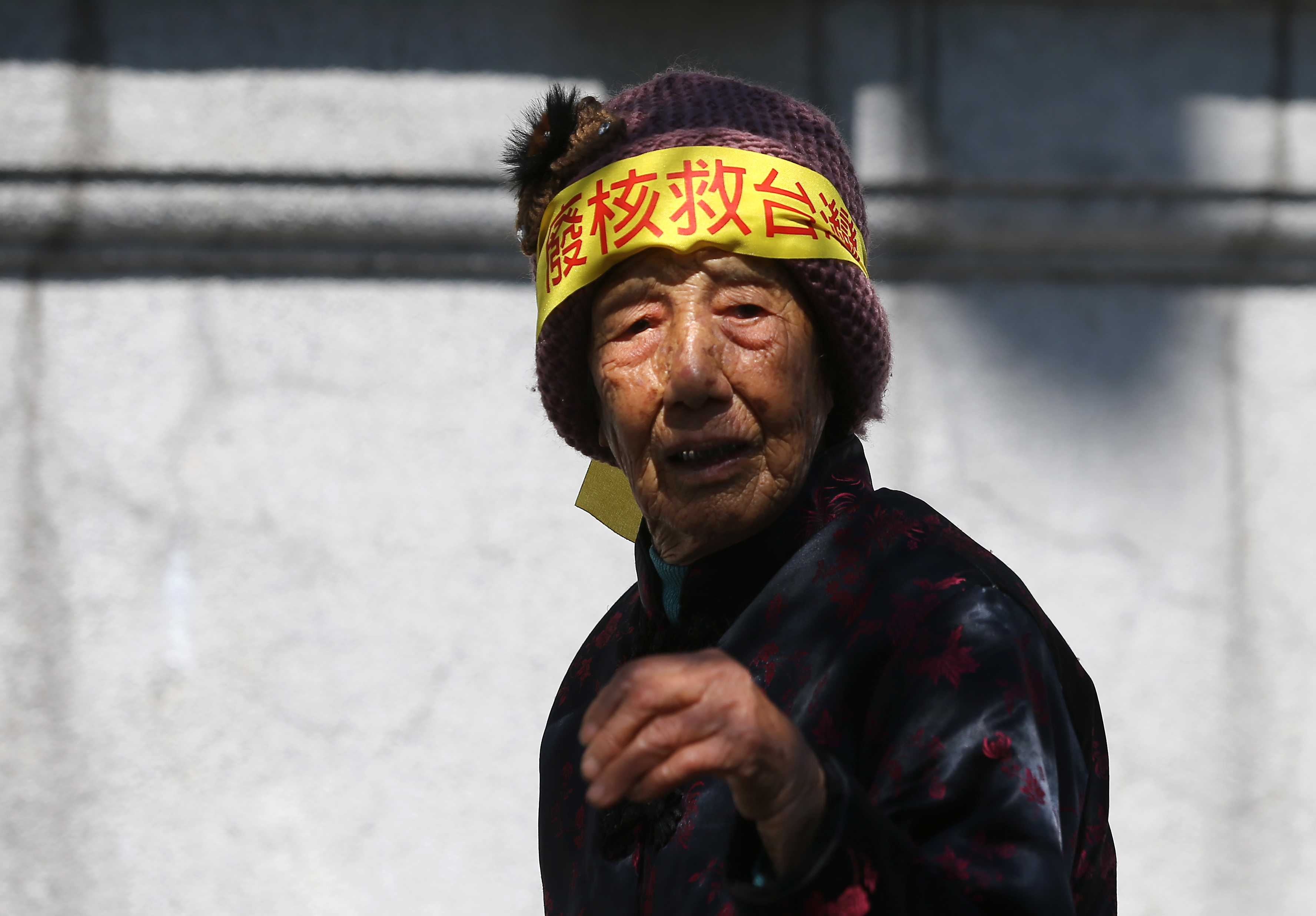 An activist takes part during a protest against the use of nuclear energy in front of the presidential office in Taipei, Taiwan, on March 11th, 2018. Hundreds of Taiwanese people took to the streets to demand the government keep its pledge to abolish the use of nuclear energy by 2025.