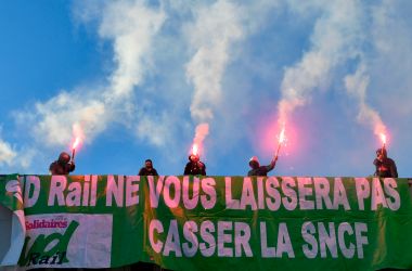 Members of a railway union hold flares during a protest against the reform of the French state-owned railway company SNCF in Paris, France, on March 12th, 2018.