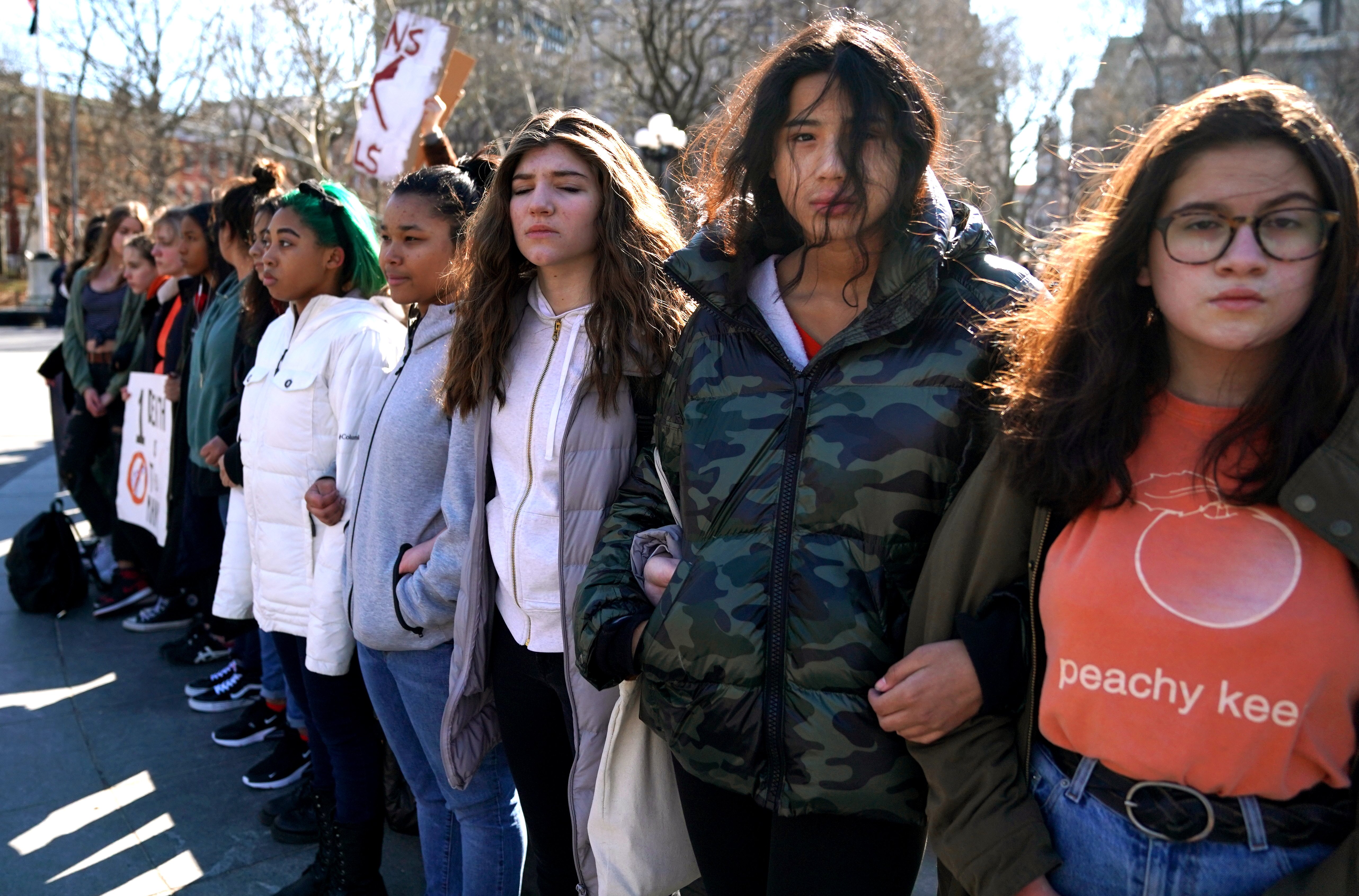 Students from Harvest Collegiate High School in New York City, New York, form a circle around the fountain in Washington Square Park to take part in a national walkout to protest gun violence.