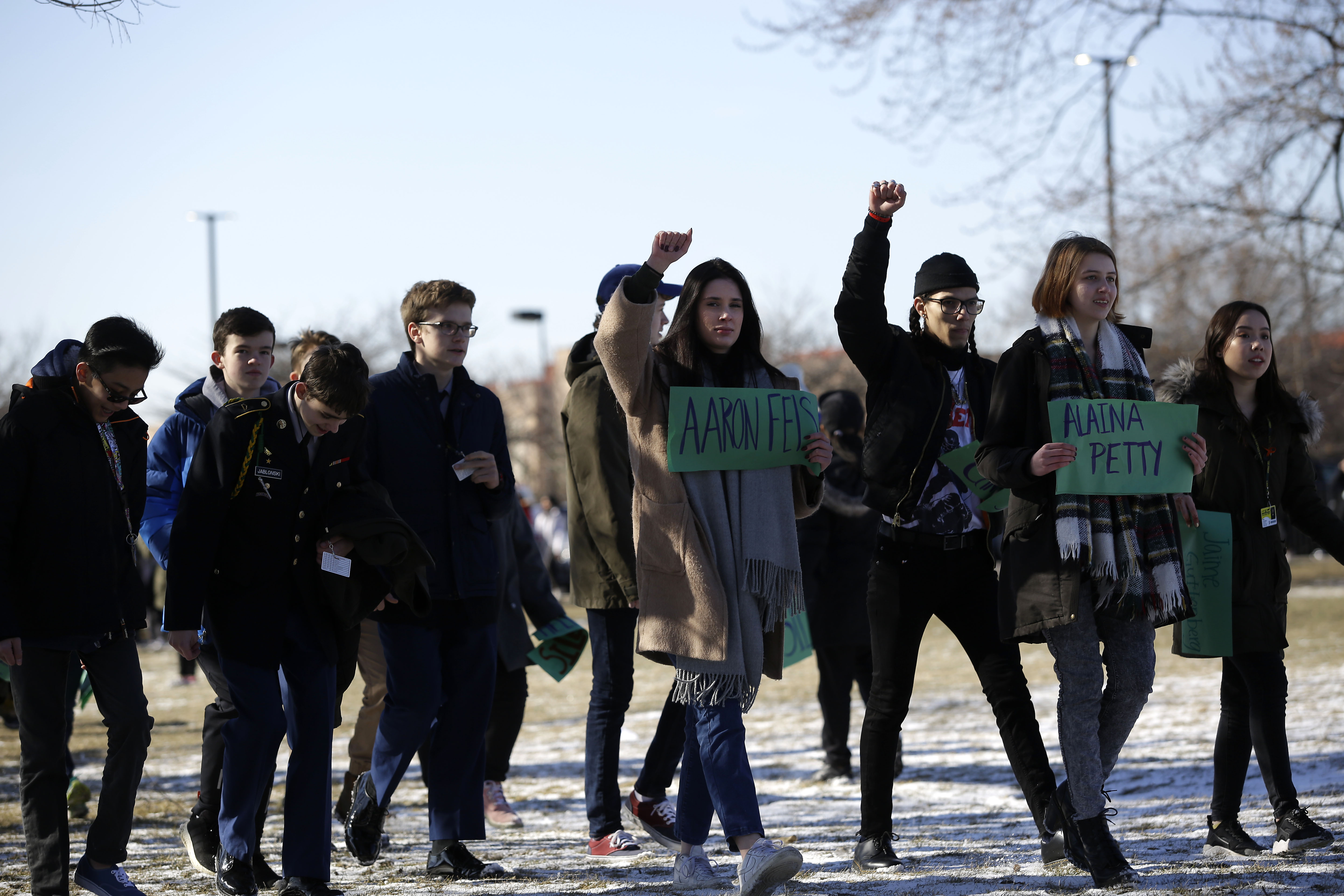 Students from Lane Technical College Preparatory High School hold signs in Chicago, Illinois.