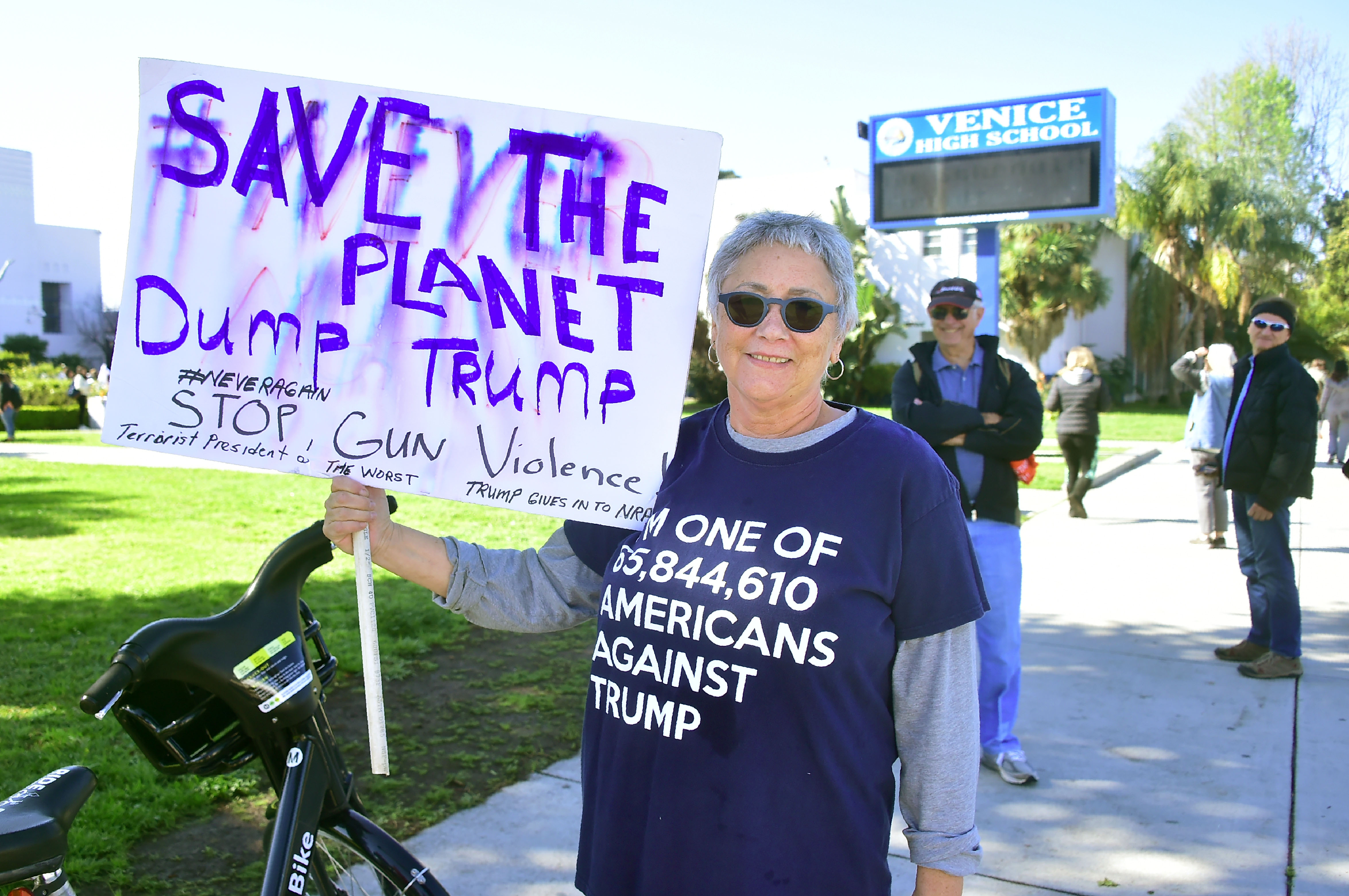 A supporter displays a placard at Venice High School in Los Angeles, California.