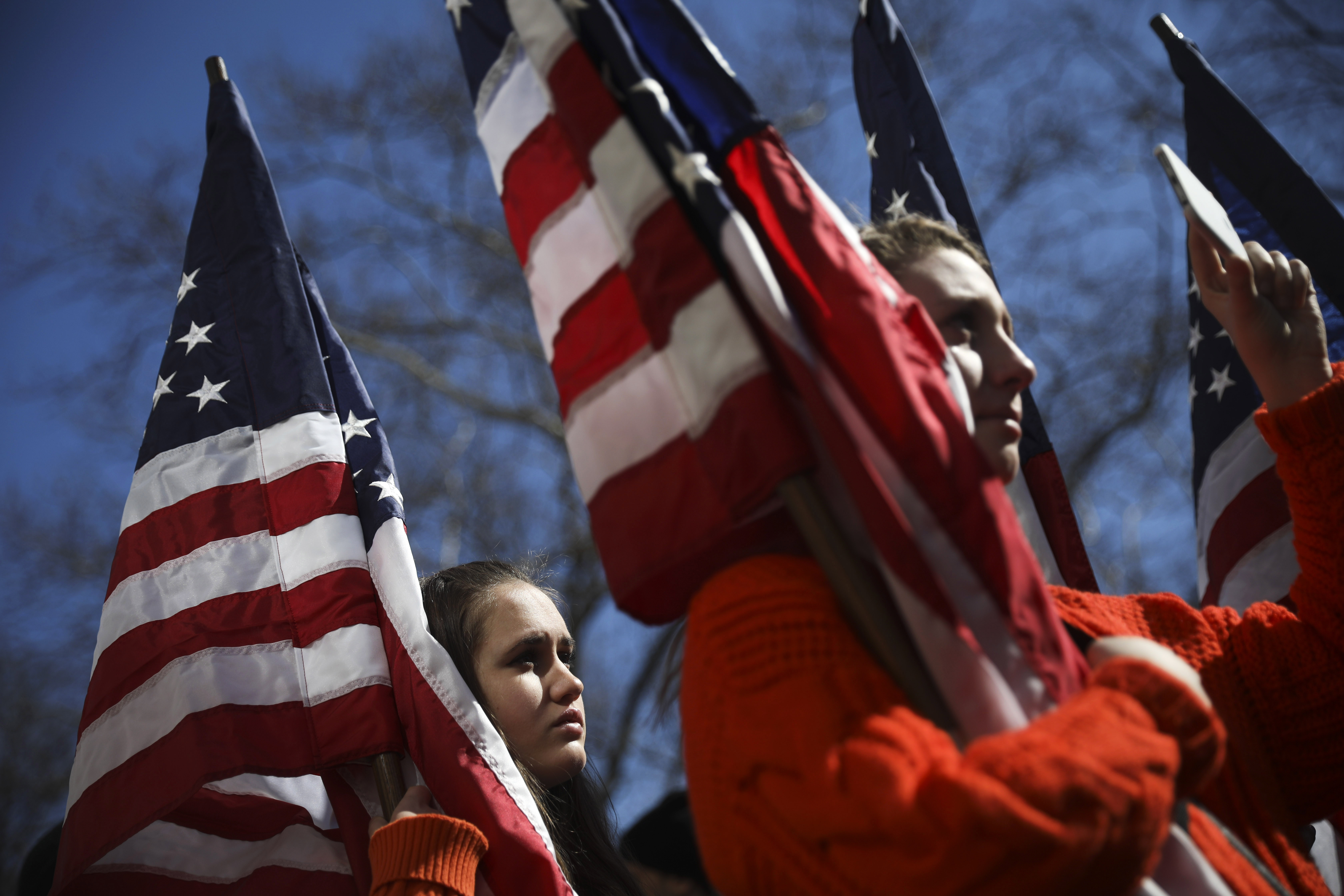 High school students from New Jersey hold American flags as they attend the March For Our Lives rally just north of Columbus Circle in New York City. Thousands of demonstrators, including students, teachers, and parents are gathering in Washington, New York City, and other cities across the country for an anti-gun violence rally organized by survivors of the Marjory Stoneman Douglas High School school shooting.