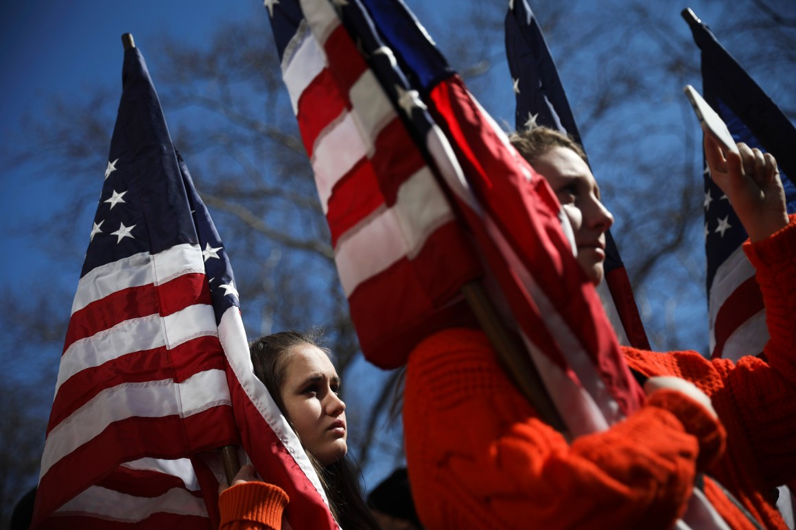 High school students from New Jersey hold American flags as they attend the March For Our Lives rally just north of Columbus Circle in New York City. Thousands of demonstrators, including students, teachers, and parents are gathering in Washington, New York City, and other cities across the country for an anti-gun violence rally organized by survivors of the Marjory Stoneman Douglas High School school shooting.