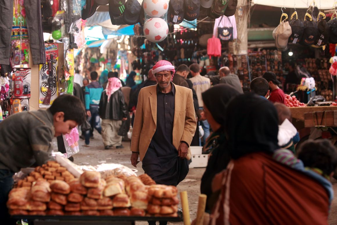 A man walks in the open air market in Manbij, northern Syria, on March 28th, 2018.