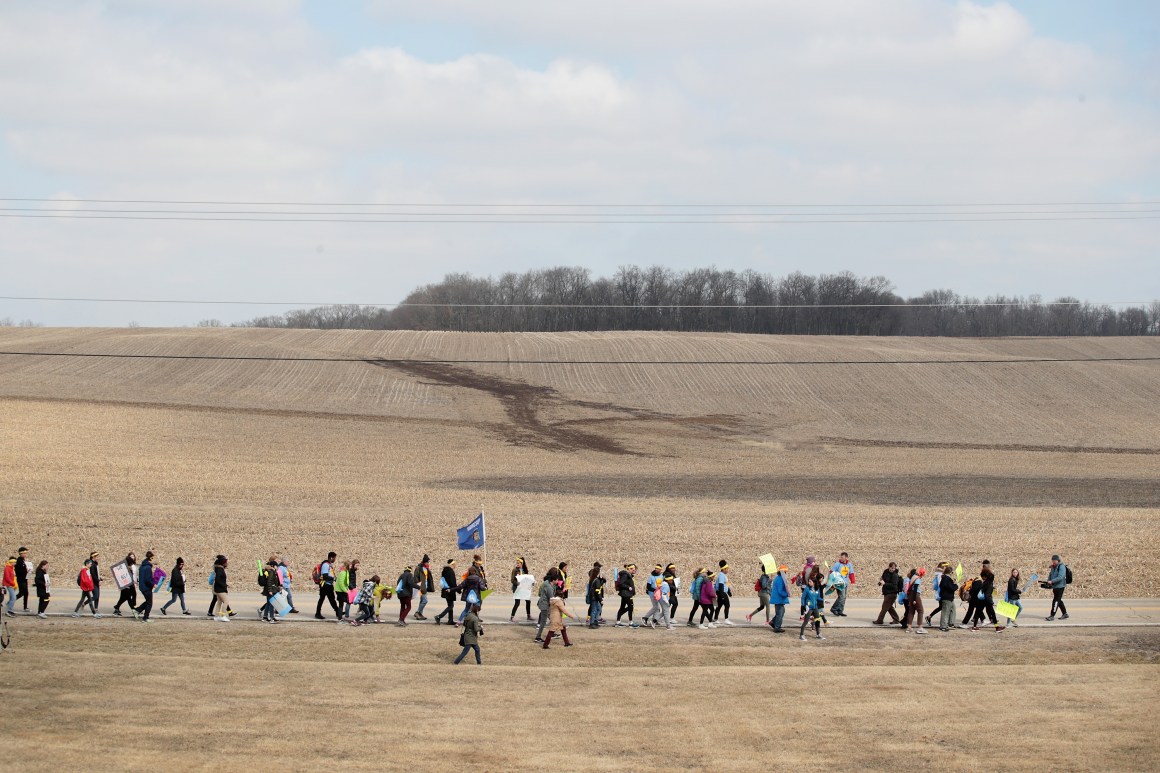 Students march the last leg of a 50-mile journey into the hometown of House Speaker Paul Ryan (R-WI) to call attention to gun violence on March 28th, 2018, in Janesville, Wisconsin. About 40 students from around Wisconsin organized the march, dubbed 50 Miles More, to keep alive the spirit and dialog of the recent March for Our Lives events.