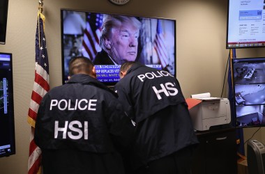 Homeland Security Investigations ICE agents work in a control center.