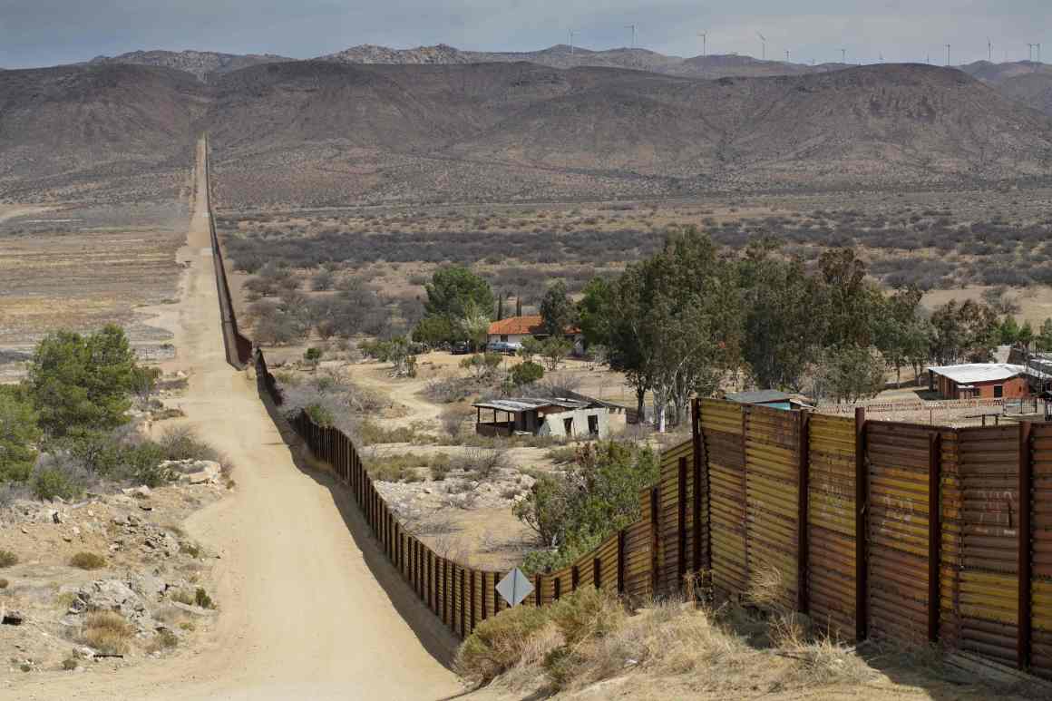 Houses are seen on the Mexican side of the U.S.–Mexico border fence on April 6th, 2018, in Jacumba, California.