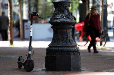 A Bird scooter sits parked on a street corner on April 17th, 2018, in San Francisco, California.