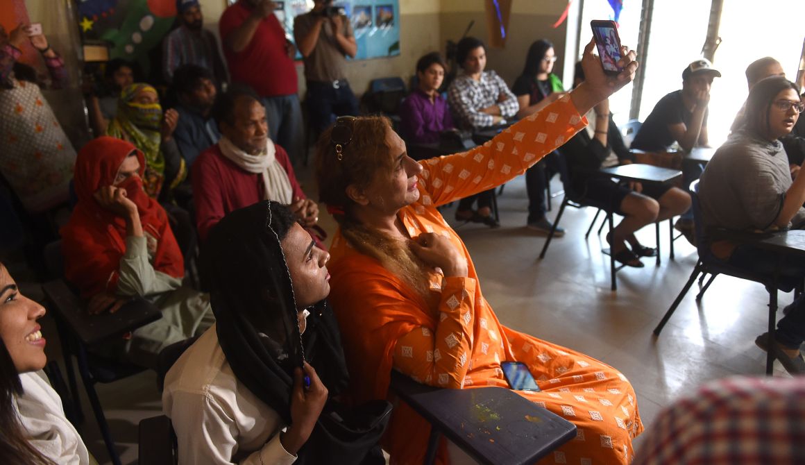 Pakistani students take a selfie in a class on the first day of the first transgender school in Lahore on April 21st, 2018.