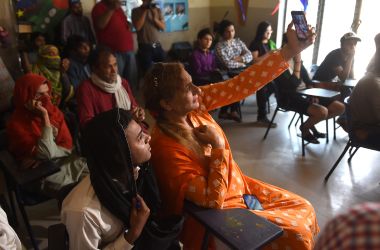 Pakistani students take a selfie in a class on the first day of the first transgender school in Lahore on April 21st, 2018.